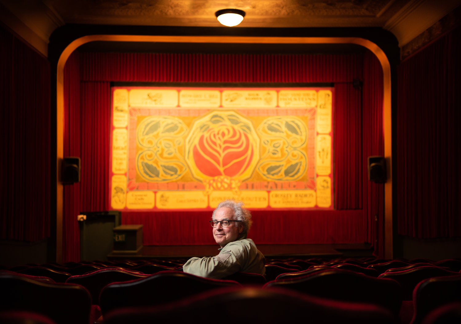 Robert “Rocky” Friedman sits in the Rose Theatre. The longtime owner has announced plans to sell the theatre business.